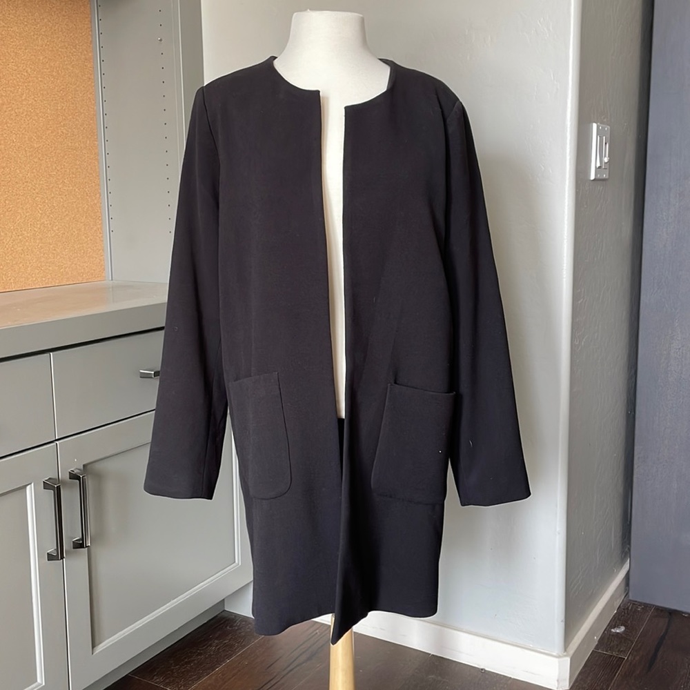 Long black collarless jacket